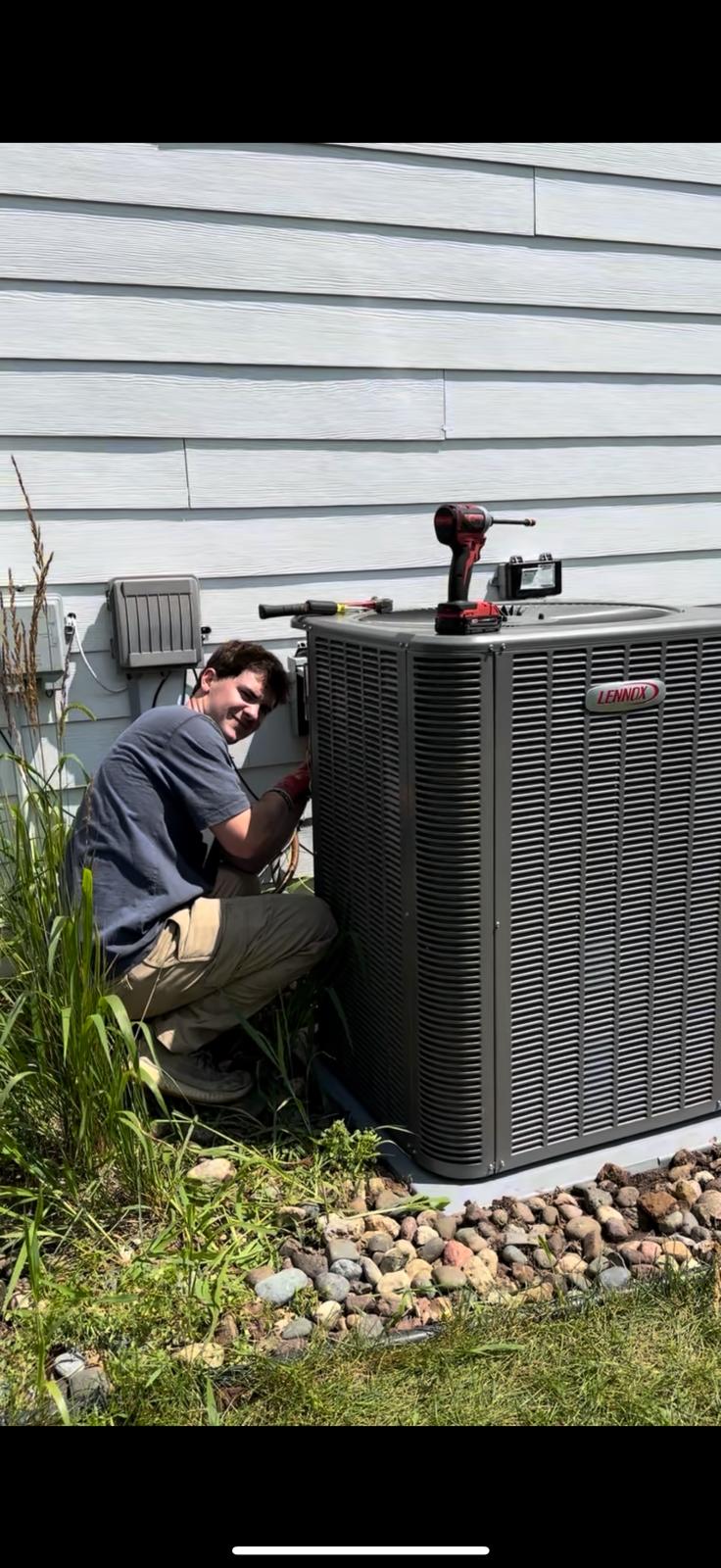 Norse team doing heat pump maintenance