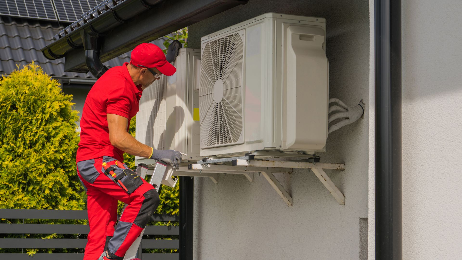 HVAC sounds - technician inspecting blower motor, Heat pump repair and maintenance under Minnesota heating services