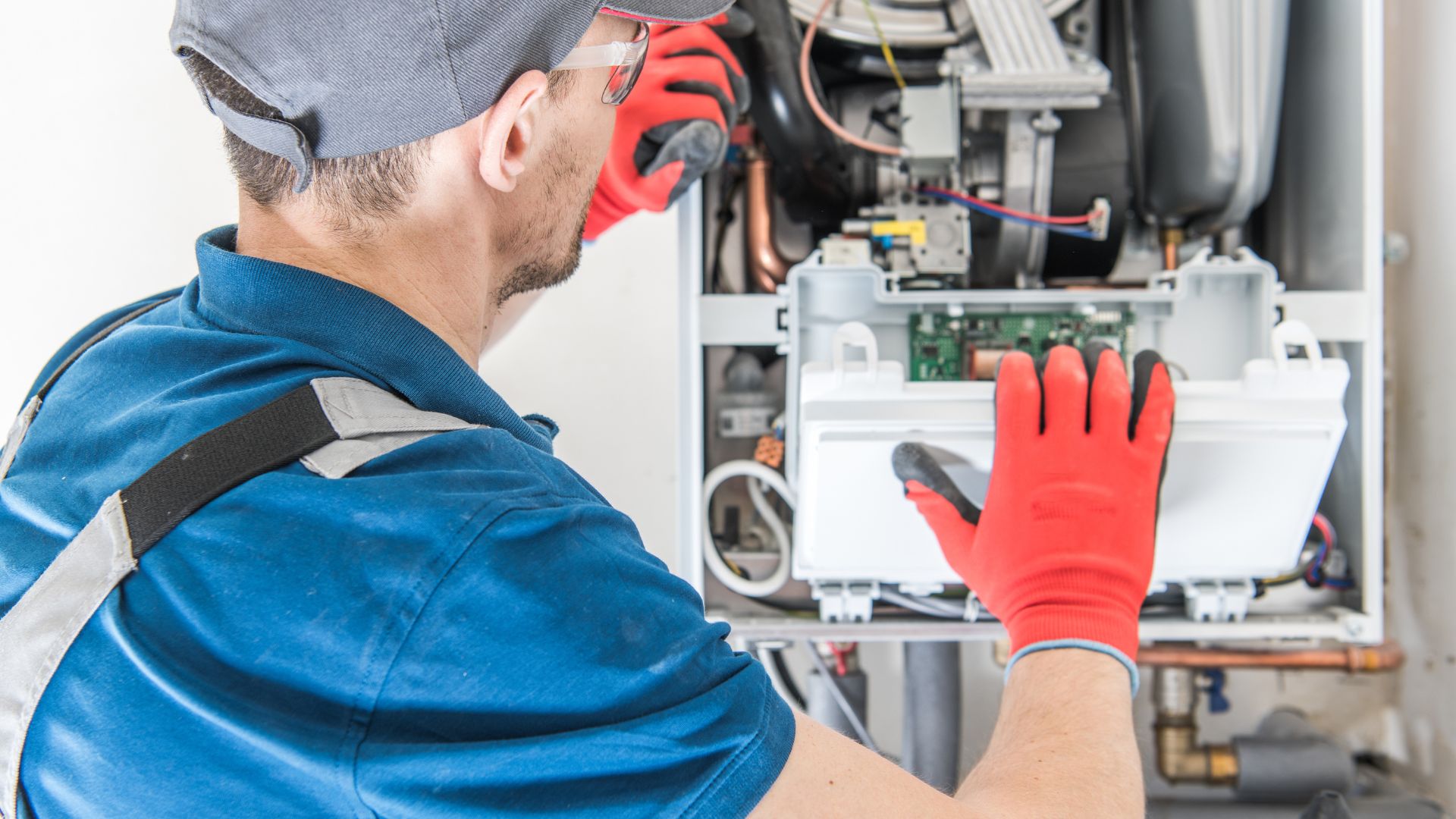 Minnesota furnace repair technician replacing furnace components | Furnace installation in Minnesota home