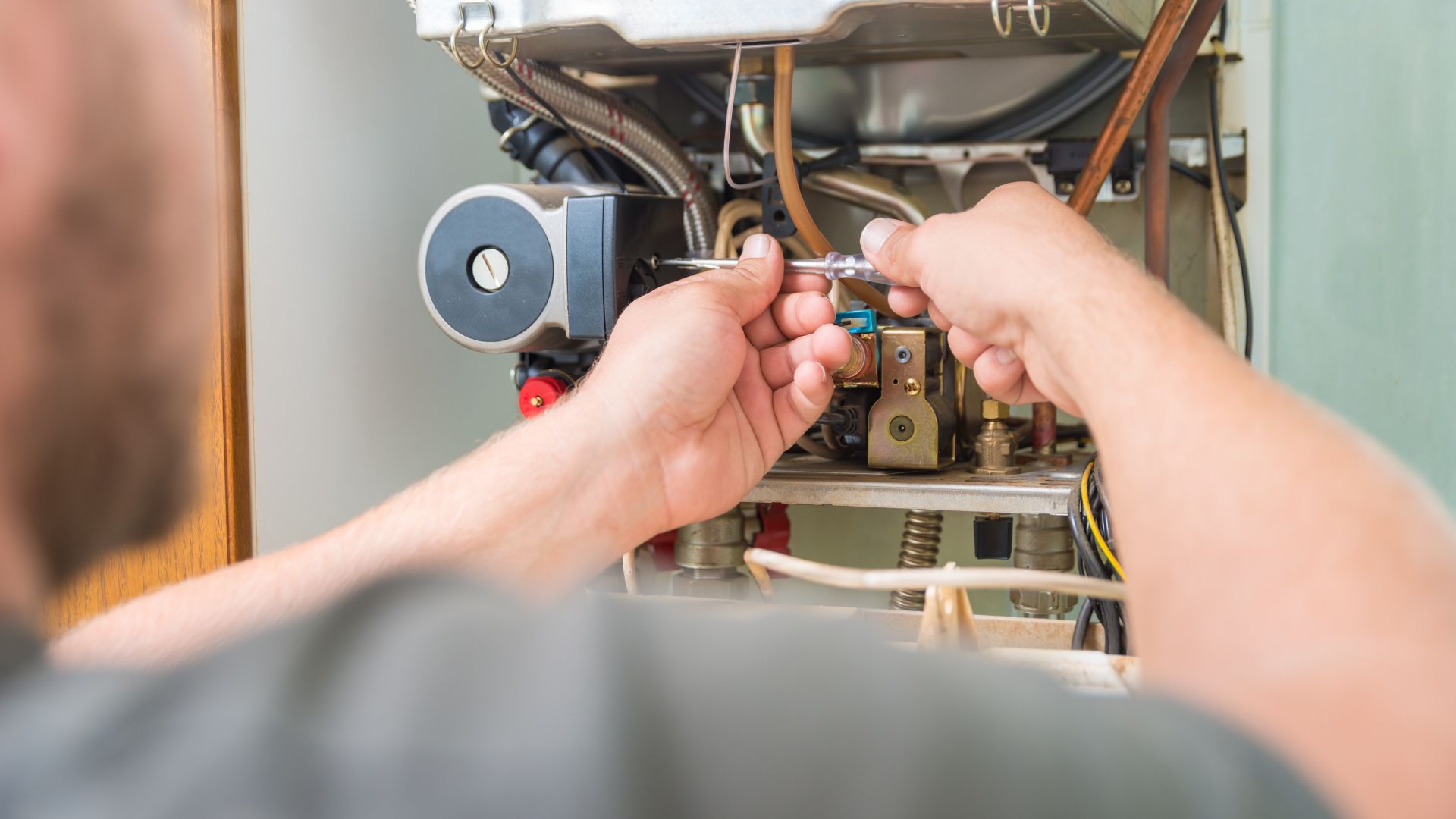 Furnace repair Minnesota – Norse Home Solutions technician at work
